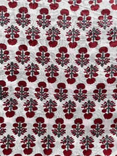 Patterned fabric with red and black design on a white background, Sapling Textiles, Fabric Store Australia, Indian Fabric online Australia
