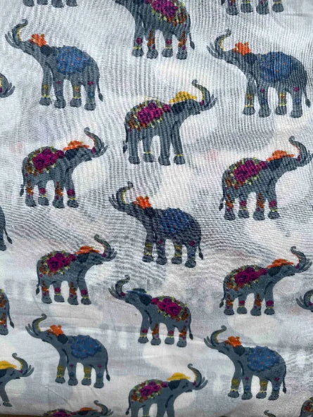Pattern of colorful elephants on a textured fabric background, Sapling Textiles, Fabric Store Australia, Indian Fabric online Australia