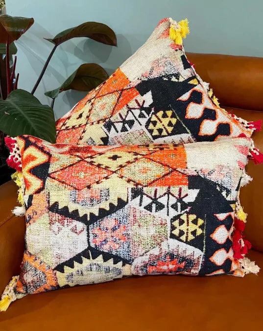 Decorative pillow with geometric pattern on a brown surface, Sapling Textiles, Fabric Store Australia, Indian Fabric online Australia