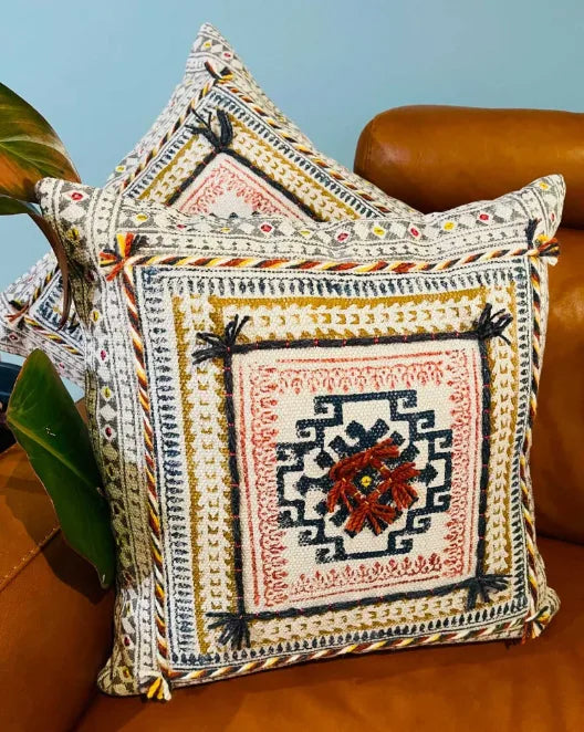 Decorative pillows with intricate patterns on a brown couch, Sapling Textiles, Fabric Store Australia, Indian Fabric online Australia