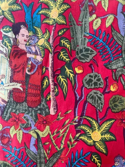 Colorful fabric with a design of a woman holding a child amidst tropical plants on a red background, Sapling Textiles, Fabric Store Australia, Indian Fabric online Australia