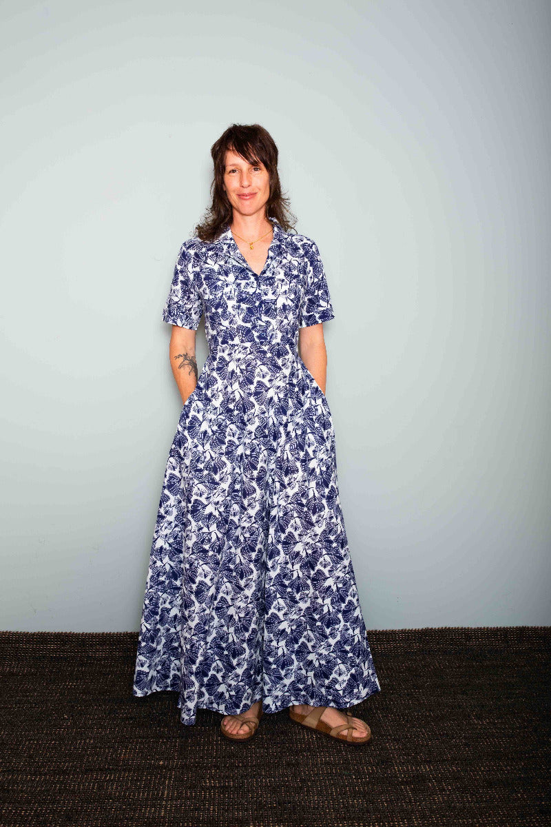 Woman wearing a blue floral dress against a plain background,  Sapling Textiles, Fabric Store Australia, Indian Fabric online Australia