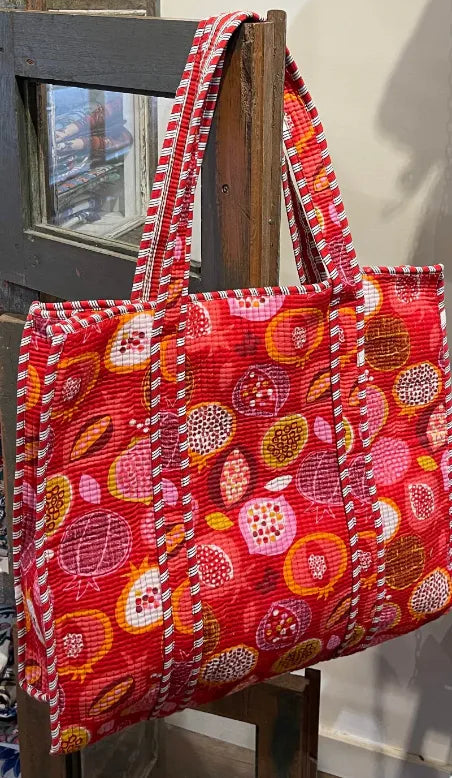 Red patterned tote bag on a wooden chair,  Indian fabric, block print fabric, Indian block print fabric, Indian woodblock print fabric, Indian cotton fabric, Online fabric shop Australia