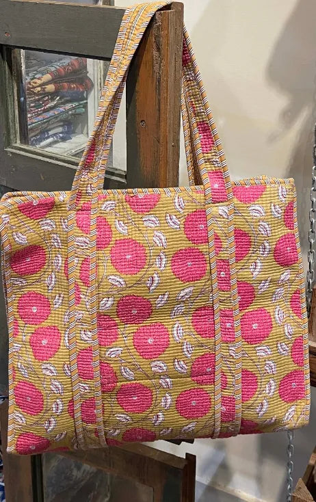 Handbag with pink floral pattern on a wooden stand, Indian fabric, block print fabric, Indian block print fabric, Indian woodblock print fabric, Indian cotton fabric